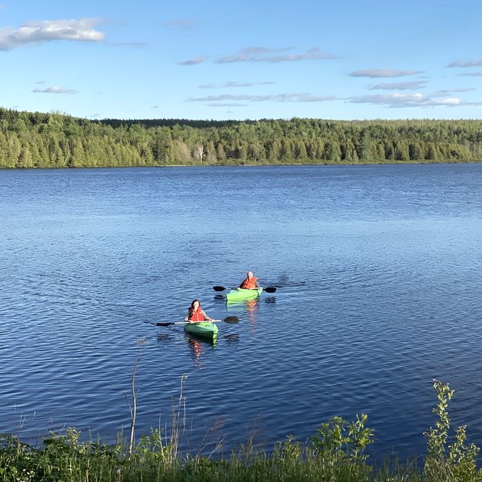 Two kayakers on a Maine lake in summer